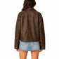Women's distressed brown oversized leather jacket back view on white background
