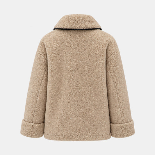 A beige sherpa fleece jacket shown from the back, featuring a high collar with a thin black trim and cuffed sleeves, set against a light gray background.