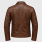 A brown faux leather jacket shown from the back, featuring a distressed texture and classic collar, set against a plain white background.